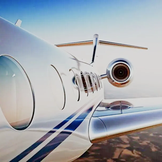 Private jet on the tarmac ready for a chauffeur-driven airport transfer