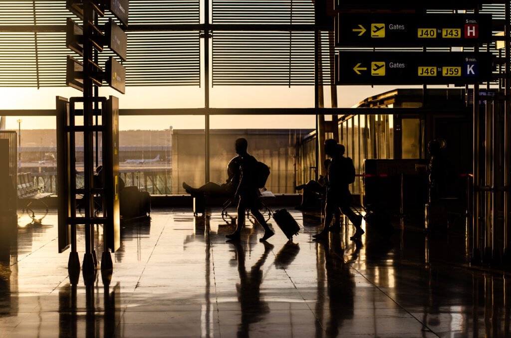 Passengers walking through a Manchester Airport terminal after a Hale transfer