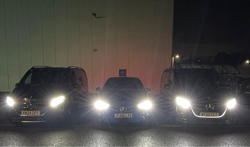 Royale Rides chauffeur fleet with headlights on before an overnight long distance journey from Manchester