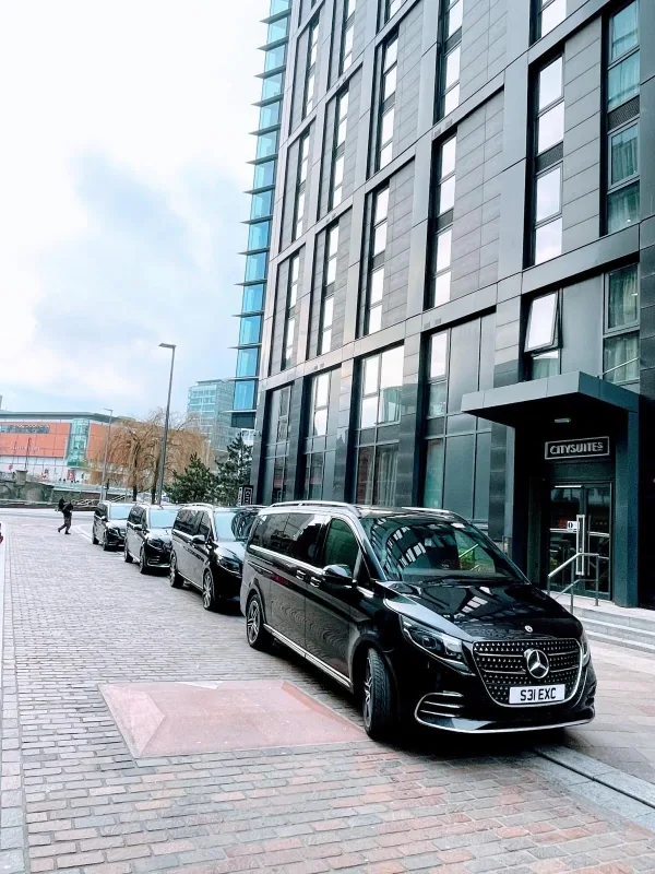 Royale Rides chauffeur vehicles outside a Manchester office district for full day hire