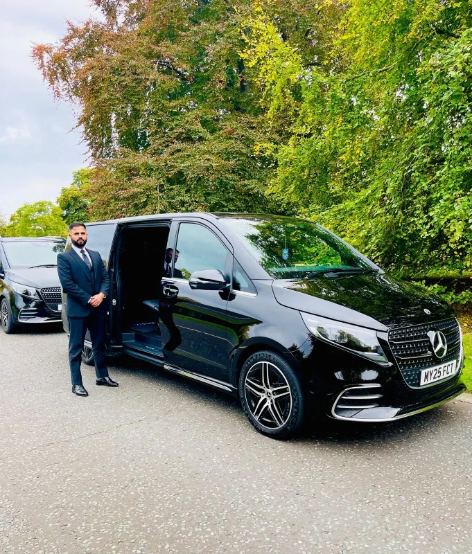 Royale Rides Mercedes V-Class on a tree-lined driveway for a group transfer