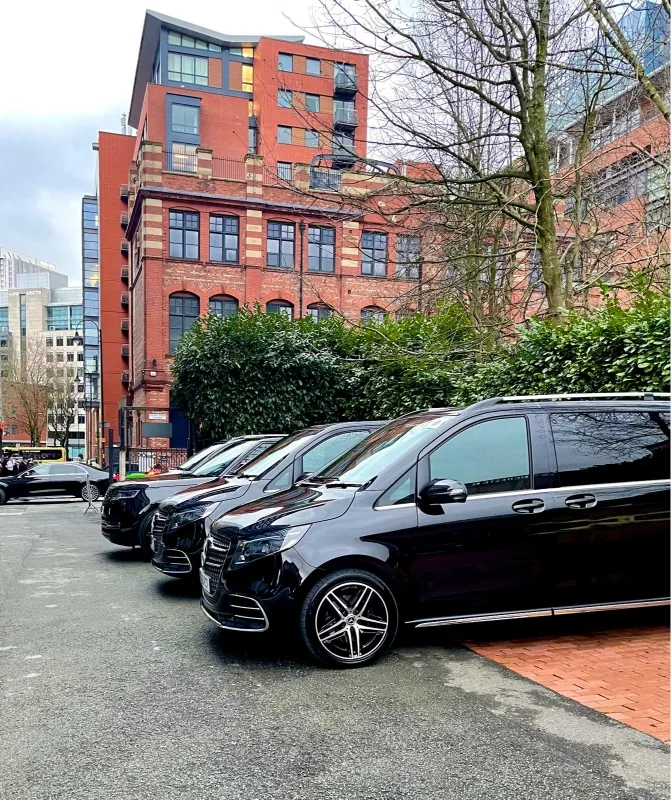 Royale Rides executive chauffeur car on a Manchester street for corporate travel from Wilmslow