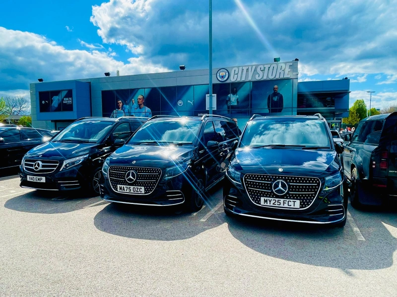 Royale Rides executive fleet parked at a Manchester business venue before a client meeting