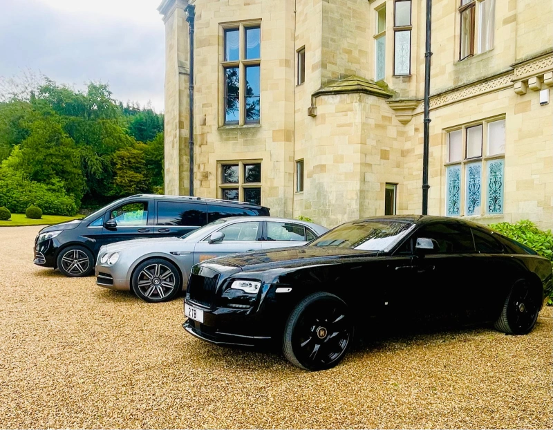 Wedding car lineup at a country venue for a Wigan wedding chauffeur booking