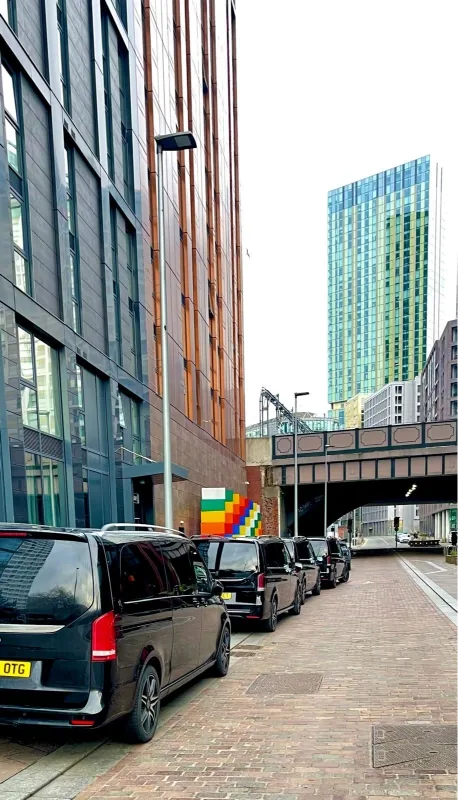 Mercedes V-Class on a Royale Rides corporate transfer through Manchester city centre