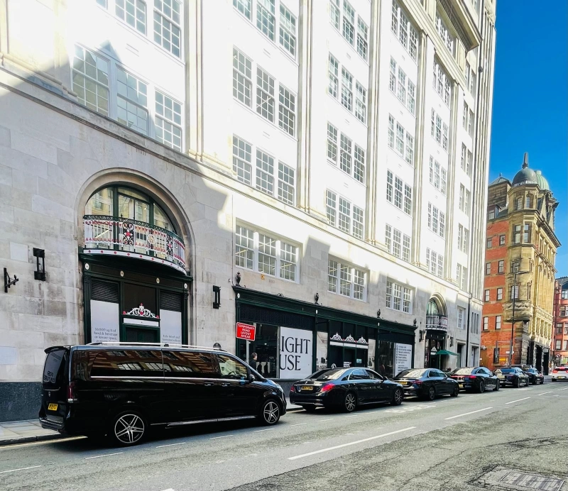 Royale Rides Mercedes V Class fleet on a Manchester street ready for Manchester Airport transfers