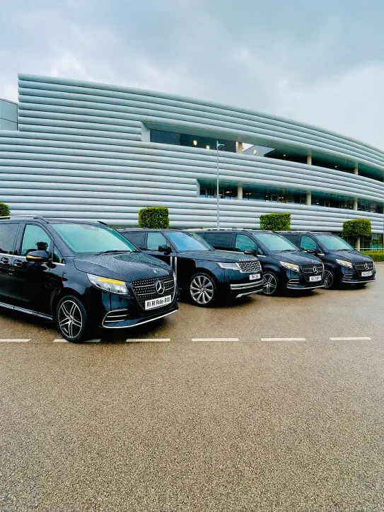 Royale Rides chauffeur fleet lined up outside a modern Manchester venue