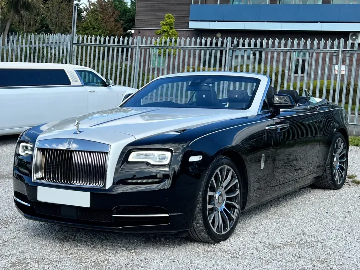Rolls-Royce Dawn convertible wedding car with a white stretch limousine behind